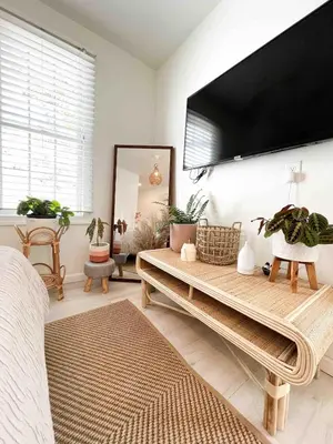 a living room with a large flat screen tv on the wall at Chic Phoenixville Retreat With Parking in Phoenixville