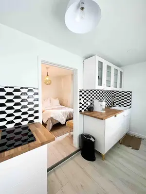 a kitchen and a bedroom with a bed in a room at Chic Phoenixville Retreat With Parking in Phoenixville