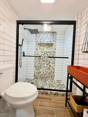 a bathroom with a shower with a toilet in it at Cozy 1BR in Philly and Rain Shower in Philadelphia
