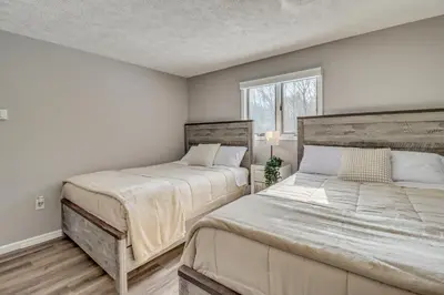 a bedroom with two beds and a window at Cabin in Lakeside Community! Poconos Getaway in Albrightsville