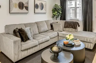 a living room with a couch and a table at 2 Mi to The Met Philadelphia Home with Rooftop Deck in Philadelphia