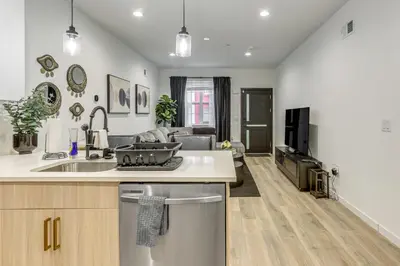an open kitchen and living room with a couch at 2 Mi to The Met Philadelphia Home with Rooftop Deck in Philadelphia