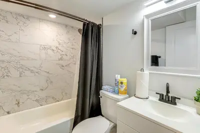 a bathroom with a toilet and a sink and a shower at 2 Mi to The Met Philadelphia Home with Rooftop Deck in Philadelphia