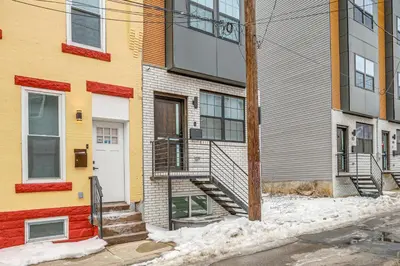 aartment building with a staircase in front of it at 2 Mi to The Met Philadelphia Home with Rooftop Deck in Philadelphia
