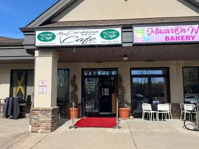 a bakery with a red rug in front of a building at Caribbean Deck Estate in Effort