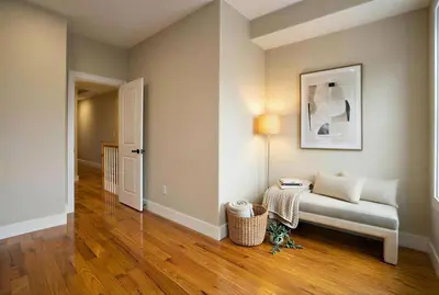 a living room with a bench and a picture on the wall at 4BR5BA Luxury World Cup hub in North Bergen