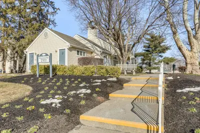 a house with a sign in front of it at Easy Commute to Philly Traveling Pros Hub! in Levittown