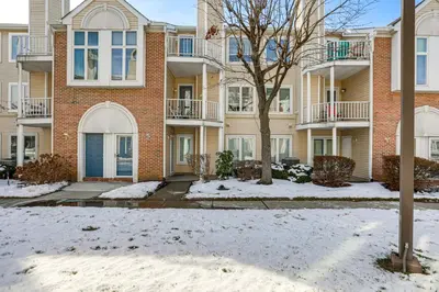 an apartment building with snow on the ground at Easy Commute to Philly Traveling Pros Hub! in Levittown