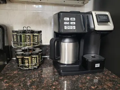 a coffee maker sitting on top of a counter at NYC Escape Easy Transit Easy Parking Quiet Area in Teaneck