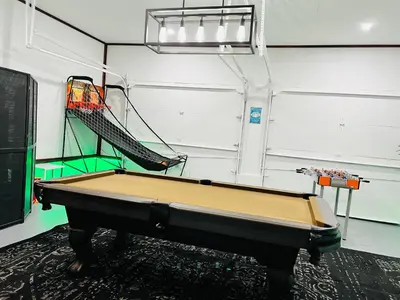 a pool table in a pool room with a rack at Woodside Haven - Game Room - Central AC - Pet Friendly in Tobyhanna