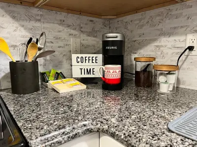a kitchen counter with a coffee time sign on it at Woodside Haven - Game Room - Central AC - Pet Friendly in Tobyhanna