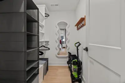 a hallway with a walk in closet with scooters at Modern 1 BR Apartment Near Center City & University City in Philadelphia
