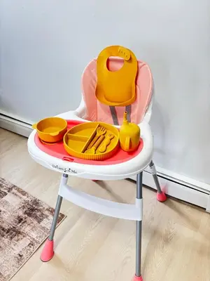a childs high chair with a toy on it at Cozy 3BR Apt in Jersey City! near NYC & Metlife! in Jersey City