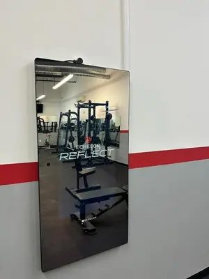 a mirror on a wall in a gym at 4-Bedroom Furnished Apartment at Temple Crossing in Philadelphia