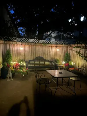 a patio with a couch and a table and chairs at Comfortable - Exc Location Apt 2BD 1BA Downtown JC 12 min to NYC in Jersey City