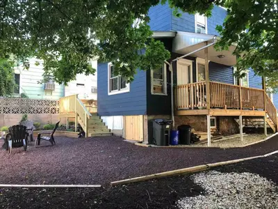 a blue house with a porch and a deck at Jim Thorpe Center House - Families and Groups Welcome - Walkable in Jim Thorpe