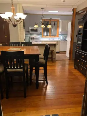 a kitchen and dining room with a table and chairs at Jim Thorpe Center House - Families and Groups Welcome - Walkable in Jim Thorpe