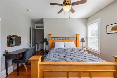 a bedroom with a bed and a ceiling fan at Jim Thorpe Center House - Families and Groups Welcome - Walkable in Jim Thorpe