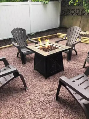 two chairs and a table with a fire pit at Jim Thorpe Center House - Families and Groups Welcome - Walkable in Jim Thorpe