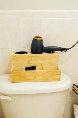 a black appliance sitting on top of a toilet at Loft at Downtown Newark in Newark
