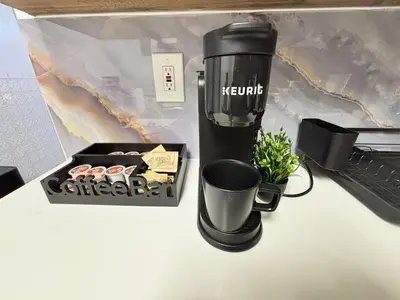 a coffee maker and a box on a table at 3BR home in Jersey city ! near metlife & NYC train in Jersey City