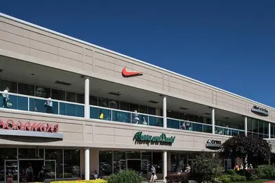 a building with a nike sign on the side of it at Spacious New4BR 3BA 2kit GameRm Firepit Amenity in Tobyhanna