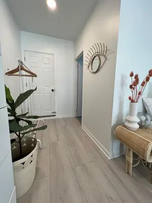 an empty hallway with a plant and a door at Home for 8, Parking & Patio in Phoenixville