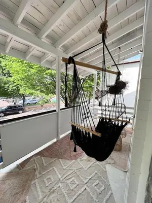 a porch with a hammock hanging from the ceiling at Home for 8, Parking & Patio in Phoenixville