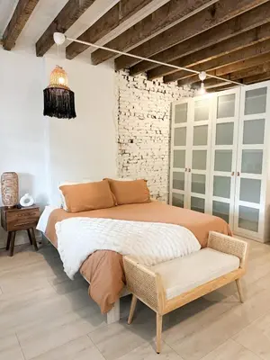 a bedroom with a large bed and a chair at Relaxing Stay Sleeps 4 & 2 Parking in Phoenixville