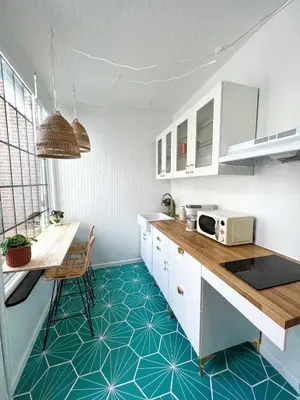 a kitchen with white cabinets and a blue floor at Relaxing Stay Sleeps 4 & 2 Parking in Phoenixville