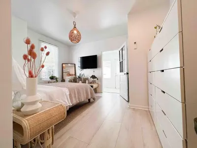 a bedroom with a bed and a dresser in it at Relaxing Stay Sleeps 4 & 2 Parking in Phoenixville