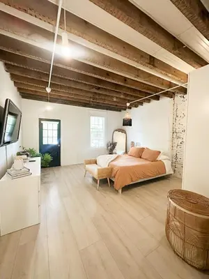 a large bedroom with a bed and a couch at Retreat with Parking Sleeps 6 in Phoenixville