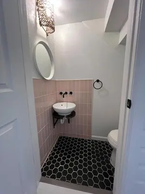 a small bathroom with a sink and a toilet at Retreat with Parking Sleeps 6 in Phoenixville