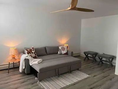 a living room with a couch and two tables at Retreat with Parking Sleeps 6 in Phoenixville
