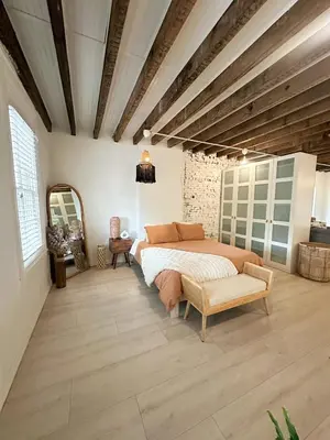 a bedroom with a bed and a chair in it at Retreat with Parking Sleeps 6 in Phoenixville
