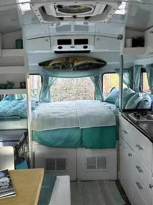 an interior view of an rv with two bunk beds at Coastal Style Bus Farm Retreat with Pond Dock and Peaceful Nature Views in Stillwater, Pennsylvania in Stillwater