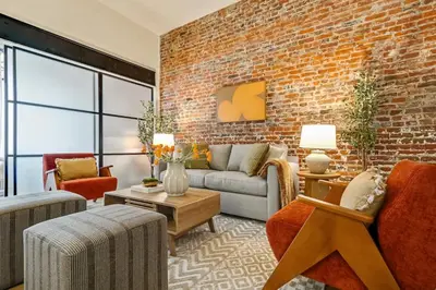 a living room with a brick wall at Cozy & Historic Old City 2 Bedroom - Sleeps 5 in Philadelphia