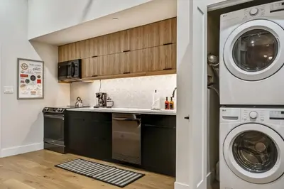 a kitchen with a washing machine and a washer and dryer at Cozy & Historic Old City 2 Bedroom - Sleeps 5 in Philadelphia
