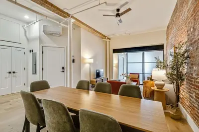 a dining room with a wooden table and chairs at Cozy & Historic Old City 2 Bedroom - Sleeps 5 in Philadelphia