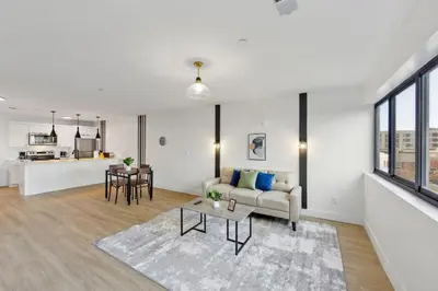 a living room with a couch and a table at Market View Residence stunning 1bd Apt in Wilmington