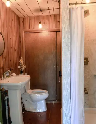 a bathroom with a toilet and a sink at 20 min Woodbury Outlet & USMA 35 min Mt Creek in Chester