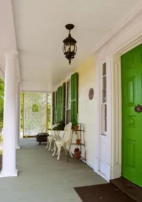 a porch of a house with green doors and chairs at 20 min Woodbury Outlet & USMA 35 min Mt Creek in Chester