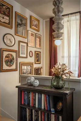 a book shelf with books and a vase of flowers on it at Cozy Artisan Loft with Literary Charm - Book Binder in Philadelphia