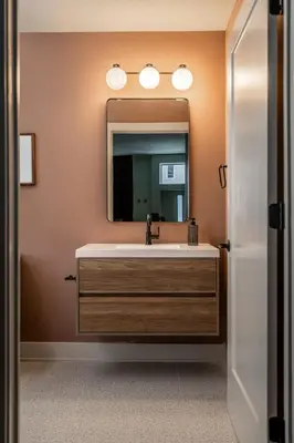 a bathroom with a sink and a mirror at Cozy Artisan Loft with Literary Charm - Book Binder in Philadelphia