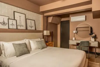 a bedroom with a bed and a mirror and a desk at Eclectic Artisan Loft With Pvt Parking - The Luminaire in Philadelphia