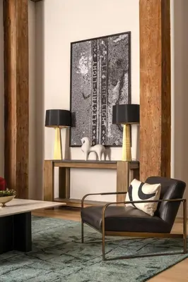 a living room with a couch and a table at Eclectic Artisan Loft With Pvt Parking - The Luminaire in Philadelphia
