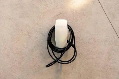 a white object with a black wire on the floor at Stunning Artisan Loft Chic & Modern - The Botanist in Philadelphia