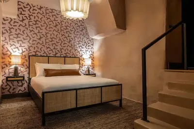 a bedroom with a bed and a wall with a pattern at Elegant Artisan Loft W Private Parking - The Weaver in Philadelphia