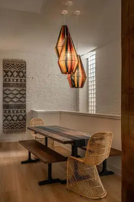 a dining room with a wooden table and chairs at Elegant Artisan Loft W Private Parking - The Weaver in Philadelphia