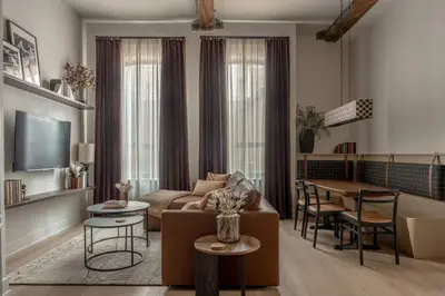 a living room with a couch and a table at Luxurious Artisan Loft w Chic Design - The Tanner in Philadelphia